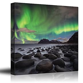 Green Northern Lights Over an Ocean Filled with Rocks