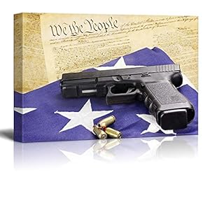 A 45 Caliber Handgun and Ammunition Resting on...