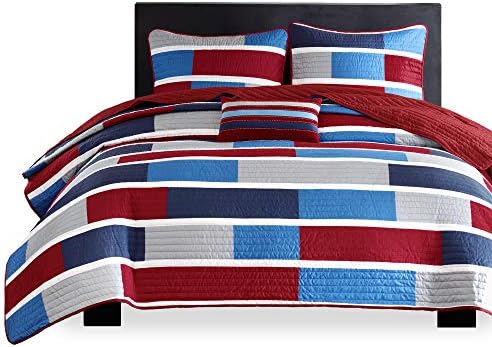 Decorative Bradley pillow set with coverlet in shades of blue, white, and gray.