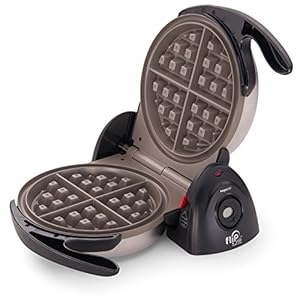 Opened waffle maker with a waffle inside