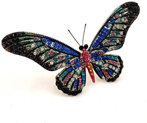 Black butterfly-shaped jewelry with pink stones on its wings, worth $17.99.