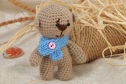 Small handmade soft toy bear cub crochet of acrylic threads