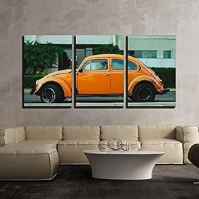 3 Piece Canvas Wall Art - Antique Orange Car Parked in Front of a Building - Modern Home Art Stretched and Framed Ready to Hang - 16"x24"x3 Panels