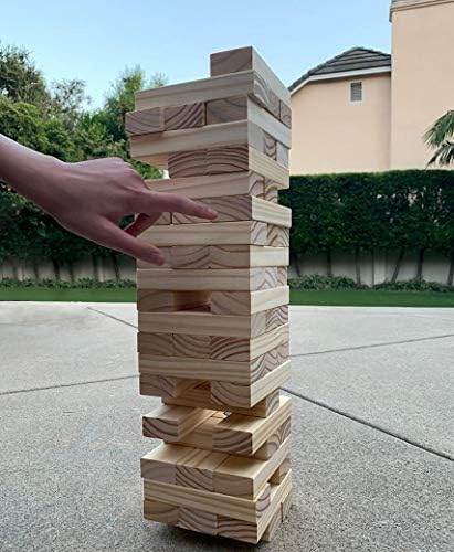 Jenga tower game with blocks and rules in a case, worth $32.99 - $28.99.