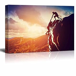 Hikers Climbing on Rock Mountain at Sunset Home...