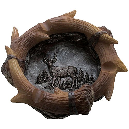 Decorative deer antler ashtray in rustic hunting lodge bar decora…