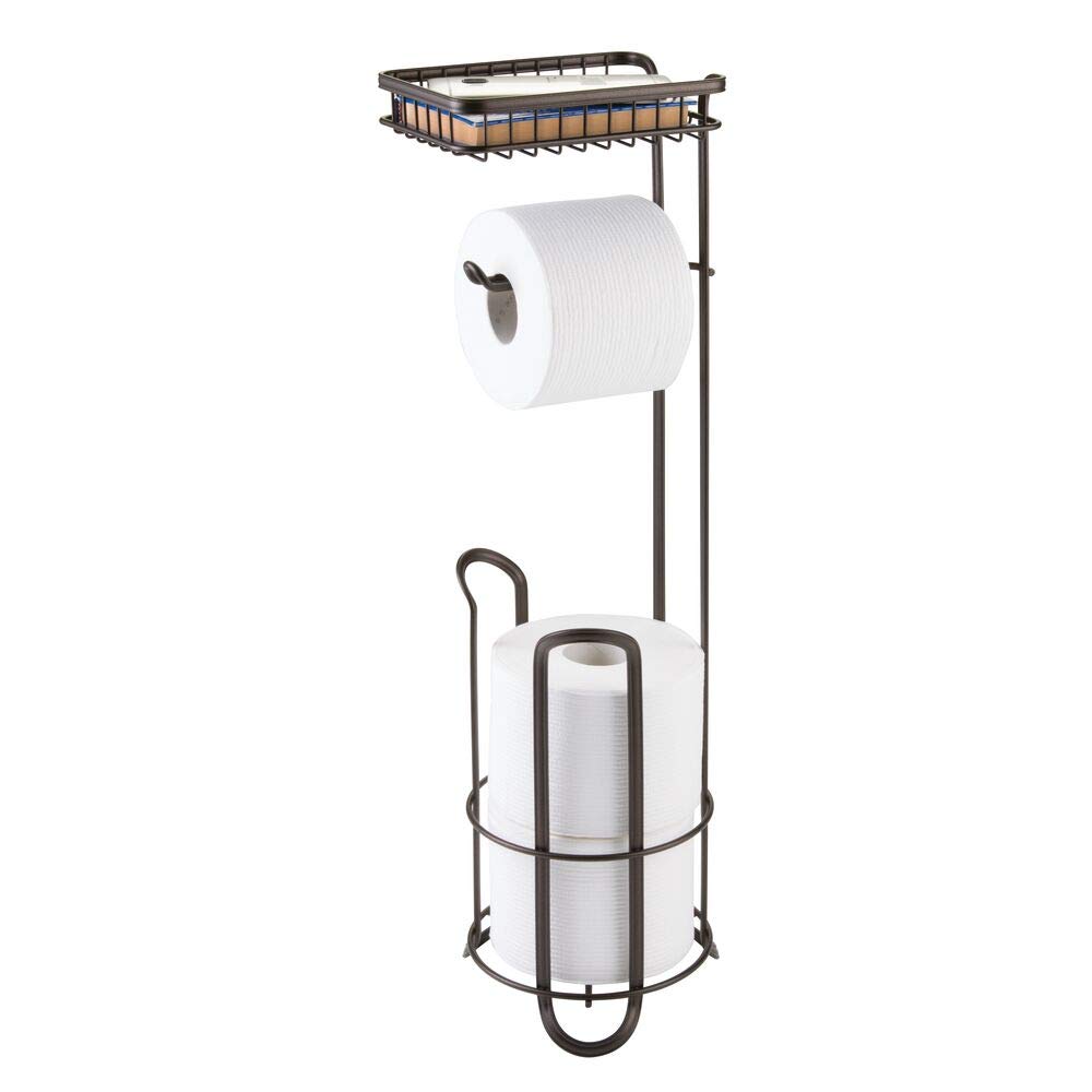 mDesign Toilet Roll Holder - Free Standing - No Drilling Necessary - Loo Roll Holder for the Bathroom - Toilet Paper Holder Stand - Added Space for Brush - Bronze