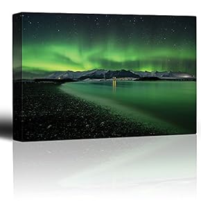 Green Northern Lights Above Snowed in Mountains and Being Reflected on a Lake - Canvas Art Home Art - 12x18 inches