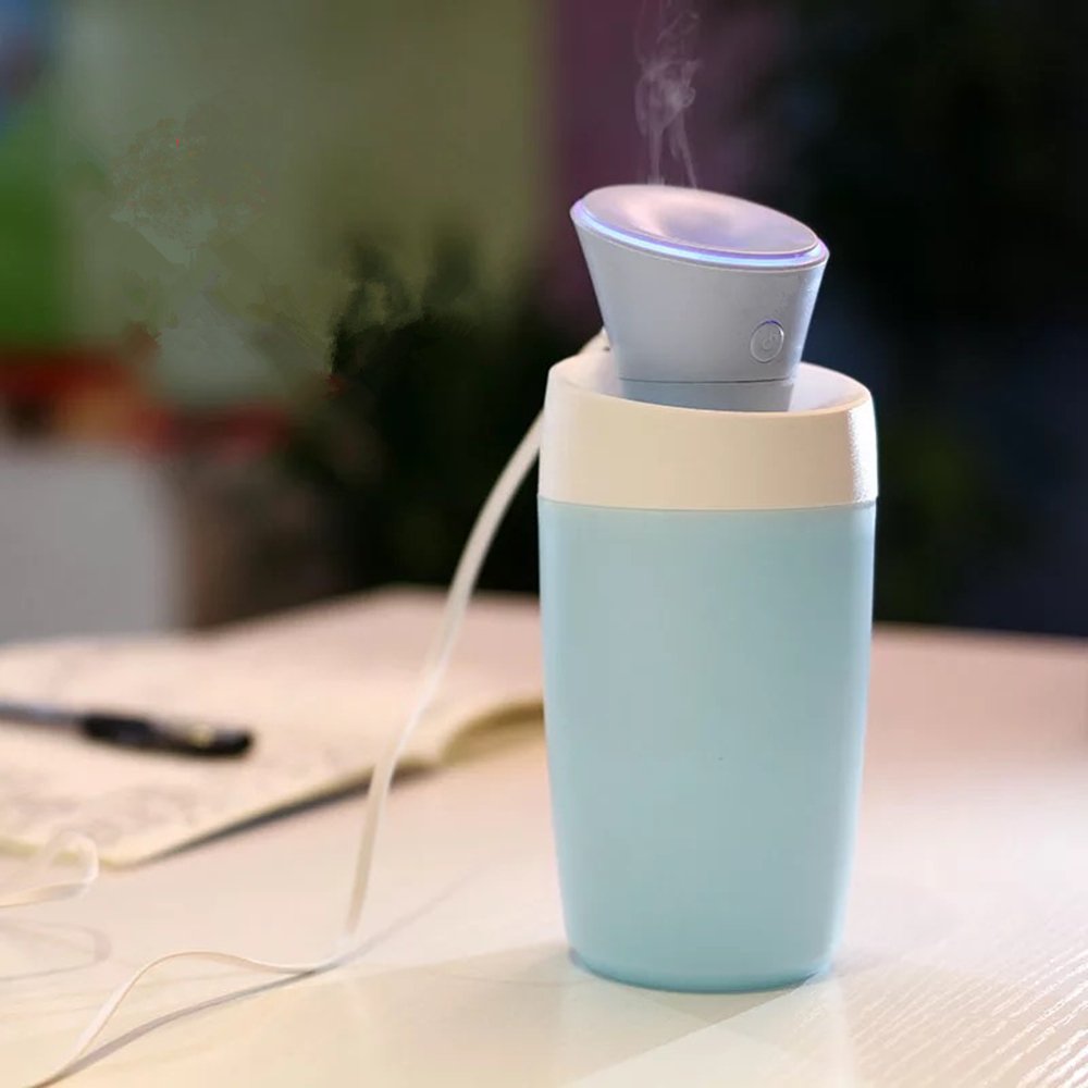 Portable blue and white humidifier.