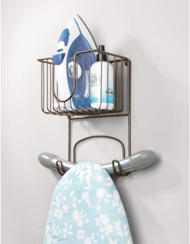 mDesign Wall Mount Metal Ironing Board Holder with Small Storage Basket - Holds Iron, Board, Spray Bottles, Starch, Fabric Refresher for Laundry Rooms - Bronze: Home & Kitchen