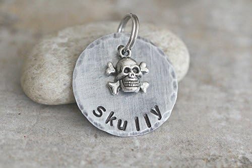 Skull pet tag, key chain, zipper pull for backpack, or gym bag identification. Made of thick and durable but lightweight tarnish free aluminum