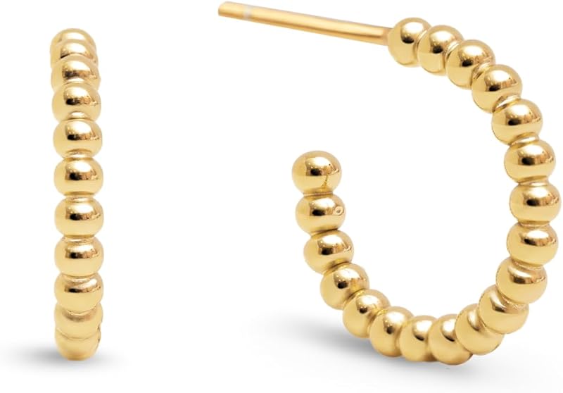 - Boucles d'oreilles Pebble Dots S. Acier avec finition plaqué or 18 kt. Fermoir en silicone plaqué. Bijoux pour femme