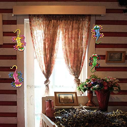 Colorful gecko wall decor artwork displayed in a garden setting.