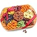 A Gift Inside Dried Fruit Assortment with Almonds on Bamboo Cutting Board Serving Tray