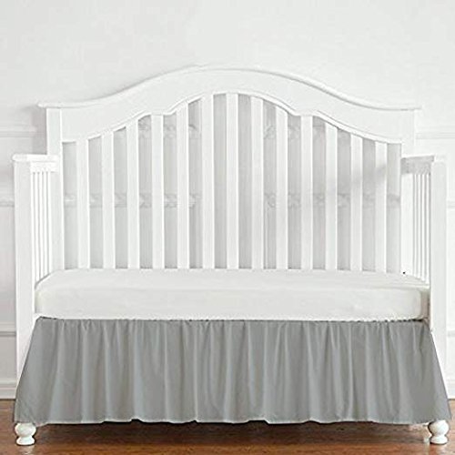 grey cot bed with mattress
