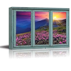 A Colorful Sunset Over Blue Mountains and Rocky Soil with Pink Flowers in Bloom - Canvas Art Home Art - 24x36 inches