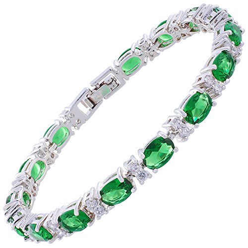 Oval cut simulated green emerald and white cubic zircon…