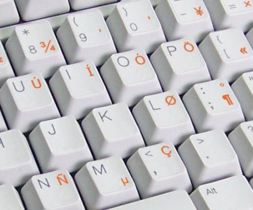 ENGLISH US INTERNATIONAL KEYBOARD STICKERS WITH ORANGE LETTERING ON TRANSPARENT BACKGROUND