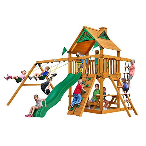Chateau Cedar Swing Set w/ Timber Shield, Wave Slide, Rock Climbing Wall, Two Swings, Ring/Trapeze Bar, Climbing Net and Picnic Table, from Gorilla Playsets