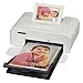 Canon SELPHY CP1300 Compact Photo Printer (White) + Canon KP-108IN Ink and Paper Set + Battery + Photo4Less Cleaning Cloth - Deluxe Value Printing Bundle