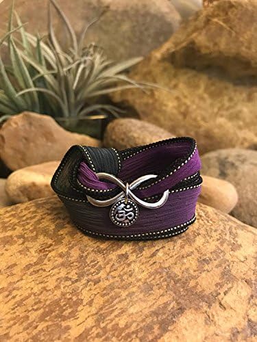 Om infinity wrap bracelet purple black with silk ribbon and charms. Great gift for yoga enthusiasts.