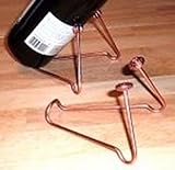 Wine Bottle Stand, Copper Colored Steel. Tilts a bottle to show the lable. Beads may vary but both ends will match.