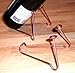 Wine Bottle Stand, Copper Colored Steel. Tilts a bottle to show the lable. Beads may vary but both ends will match.