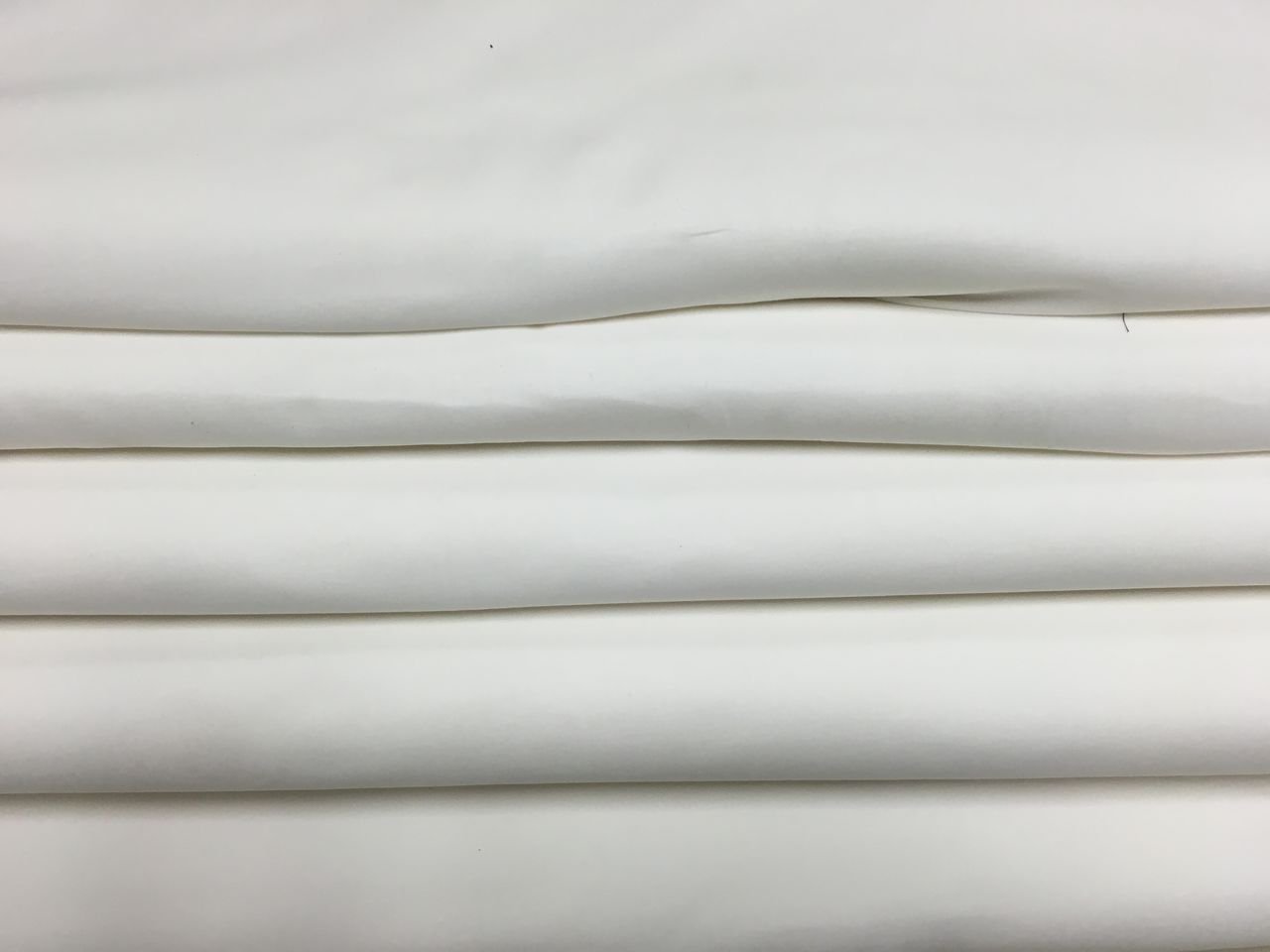 Bolt of white fabric picture