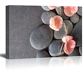Peach Colored Flower on Smooth Zen Stones