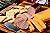 Badgers Tailgating Snack Pack Gift Basket - features Smoked Summer Sausages, 100% Wisconsin Cheeses and Crackers & Badger Can Coolie. Just the right snack for watching Sports!