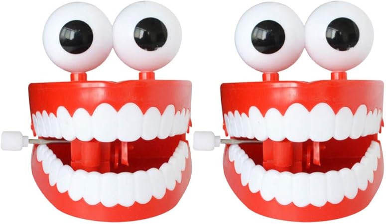 Amazon Co Jp Toymytoy 2本の歯が目のおもちゃでチャタリングする歯を巻き上げるおもちゃノベルティウォーキング時計仕掛けのおもちゃ ドラッグストア