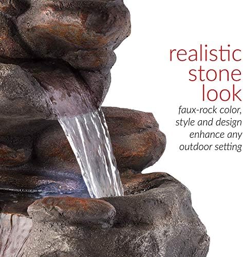 Water fountain with two ornate doors setting in a backyard.