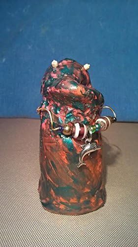 Tony. Sea Monster Charm. A unique, one of a kind, hand sculptured gift. I have swirl colors of brown and teal. I've heard people say, I'm so ugly I'm cute!