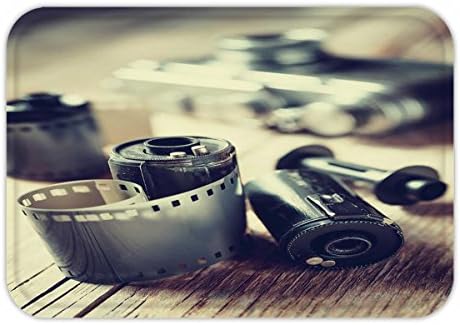 Beshowere Doormat old photo film rolls cassette and retro camera on desk vintage stylized photo