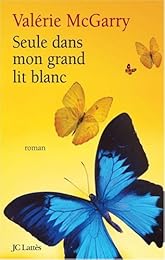 Seule dans mon grand lit blanc