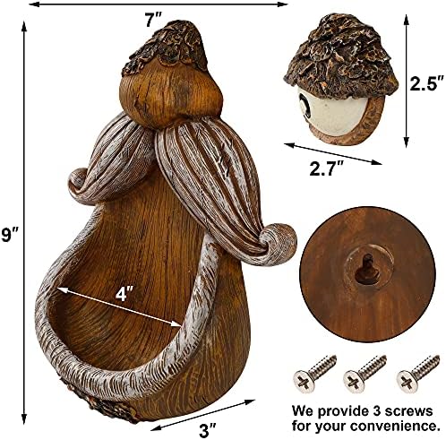 Dark backyard bird feeder hanging from a tree with glowing eyes.