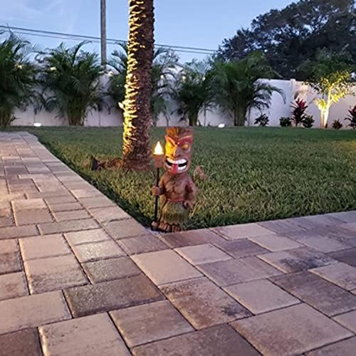 Solar-powered tiki torch in a garden setting.
