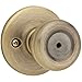 Kwikset Tylo Bed/Bath Knob in Antique Brass