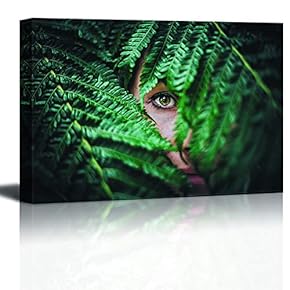 Woman Peeping in Convered by Green Leaves