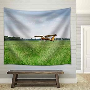 Little Yellow Airplane on Green Grass Field - Fabric Wall Tapestry Home Decor - 51x60 inches