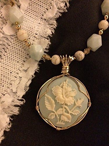 Wire wrapped flower pendant with amazonite, magnesite, glass, and 14/20 gold filled wire, chain and clasp.