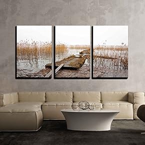 Old Wooden Jetty in Lake with Reeds in...