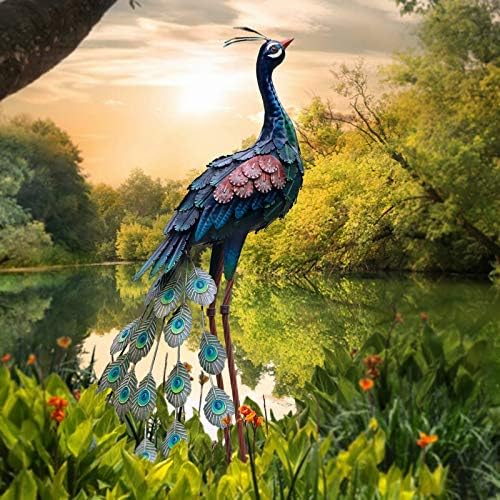 Peacock garden statue with intricate design, standing in a backyard setting.