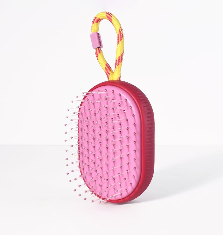 Beter - Detangling brush On-the-Go PINK. Compact travel size with cord for hanging, made from recycled plastic.
