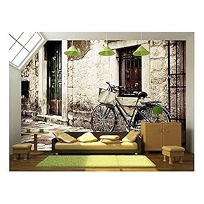 Bicycle with a Shopping Bag on Handle Bar, Left Beside Old Stone Wall - Removable Wall Mural | Self-Adhesive Large Wallpaper - 66x96 inches