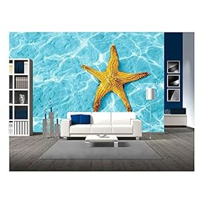 Starfish in Blue Water with Light Reflection. - Removable Wall Mural | Self-Adhesive Large Wallpaper - 66x96 inches