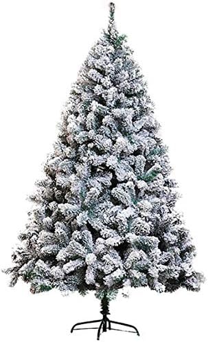 雪の群がった人工的なクリスマスツリー 消灯した白い雪のスプレークリスマス