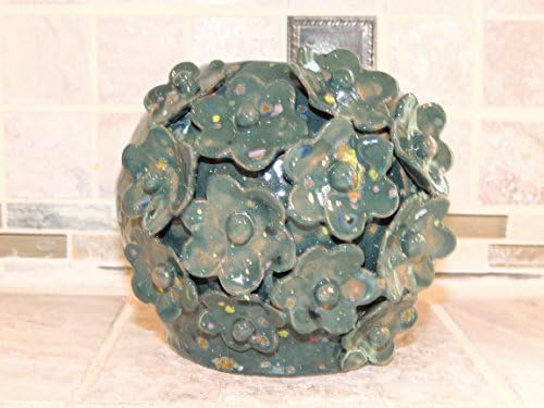 Bowl, Vase. Hand Thrown One of a kind.Hand made flowers with Teal/Green speckled glaze. Food and dishwasher safe.5 x 7 wide,Food,microwave and dishwasher safe.