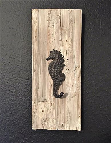 Metal Seahorse hook on pallet wood.