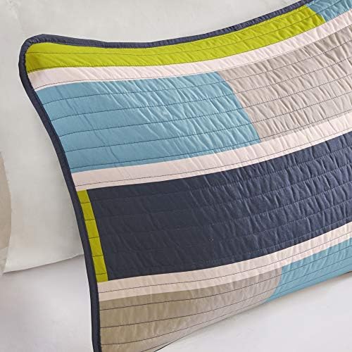 Brushed cloth decorative pillow and coverlet in beige and white colors.